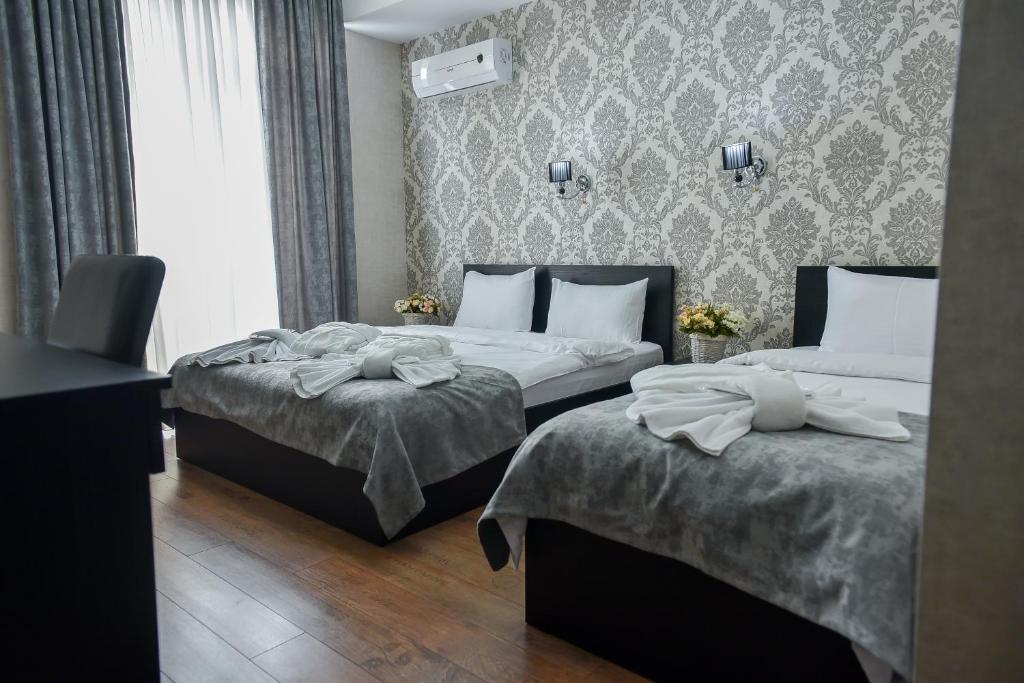 Postel nebo postele na pokoji v ubytování MariaLuis Hotel