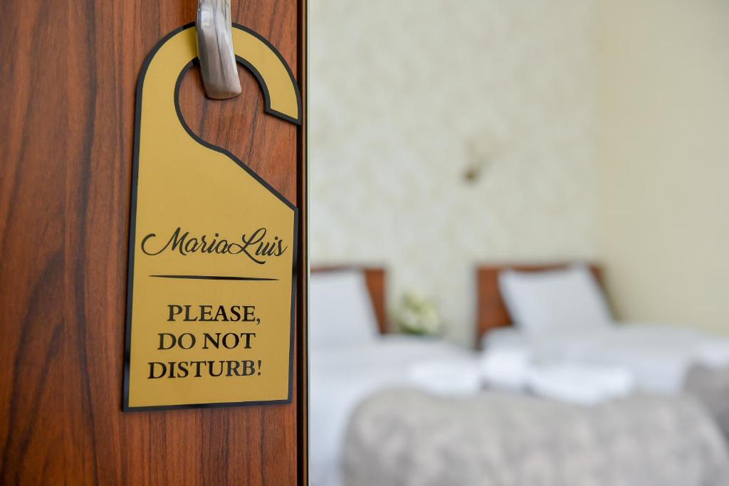 Postel nebo postele na pokoji v ubytování MariaLuis Hotel