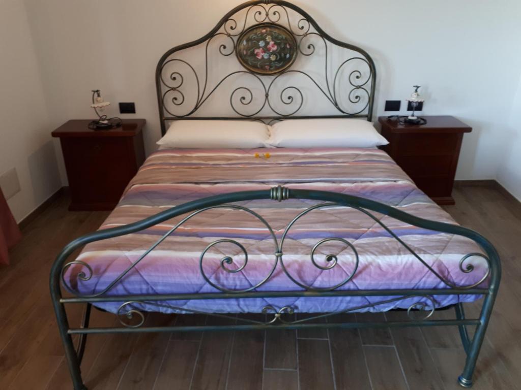 Postel nebo postele na pokoji v ubytování Agriturismo Nona Rosa