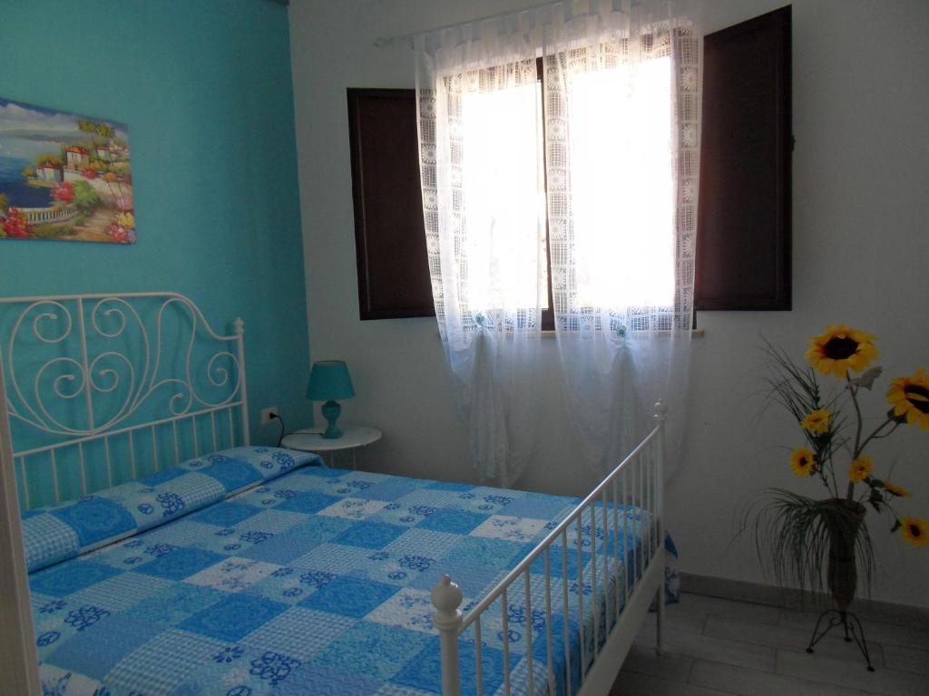 Łóżko lub łóżka w pokoju w obiekcie Resort Paradise Marina di Camerota
