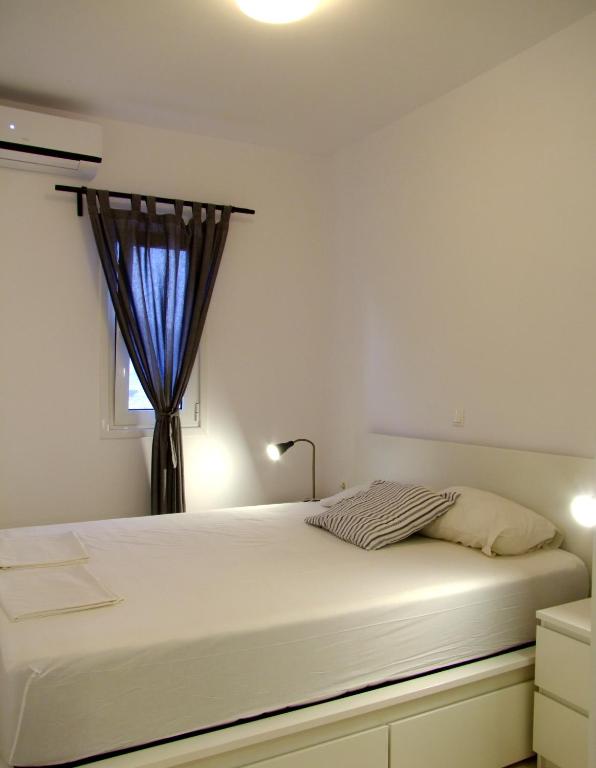 Posteľ alebo postele v izbe v ubytovaní Helios Studios & Apartments