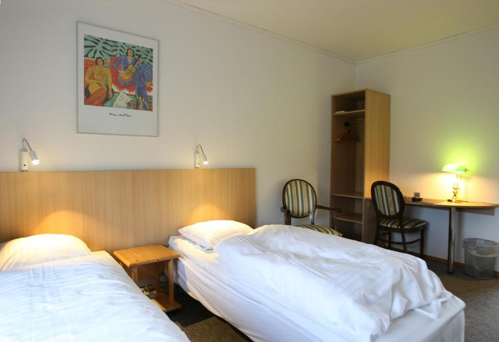 Postel nebo postele na pokoji v ubytování Hotel Bov Kro
