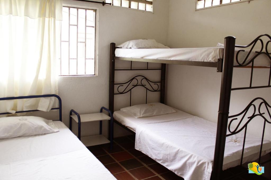 Postel nebo postele na pokoji v ubytování Hotel Campestre CENVATURS