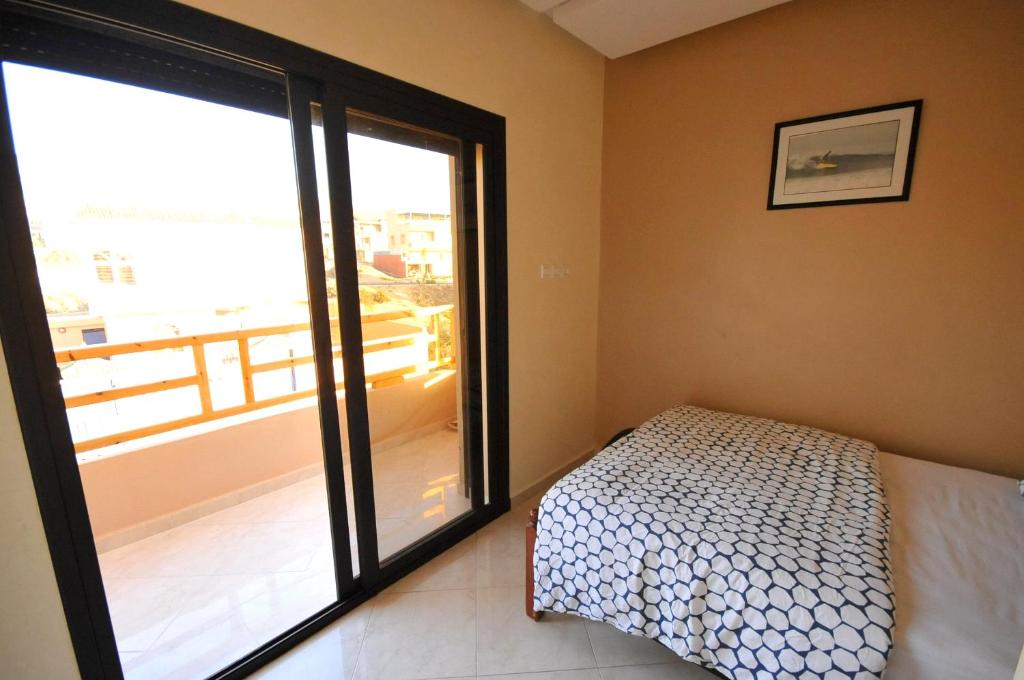 Postel nebo postele na pokoji v ubytování Travel Surf Morocco