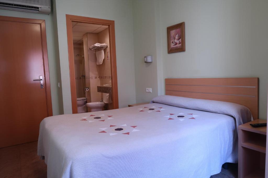Posteľ alebo postele v izbe v ubytovaní El Camí Hotel