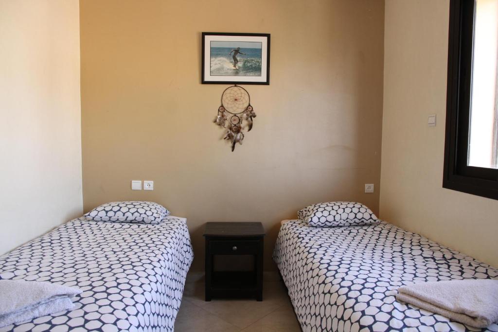 Postel nebo postele na pokoji v ubytování Travel Surf Morocco