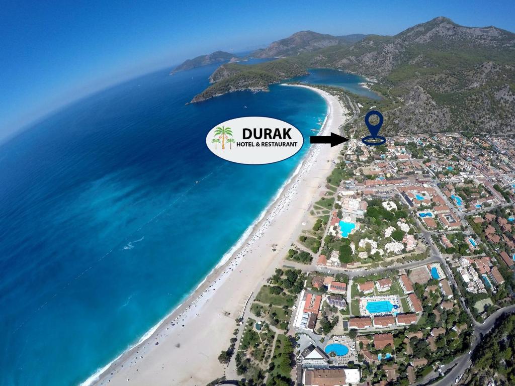 an aerial view of a beach with the dirk resort at Durak Hotel ölüdeniz in Oludeniz