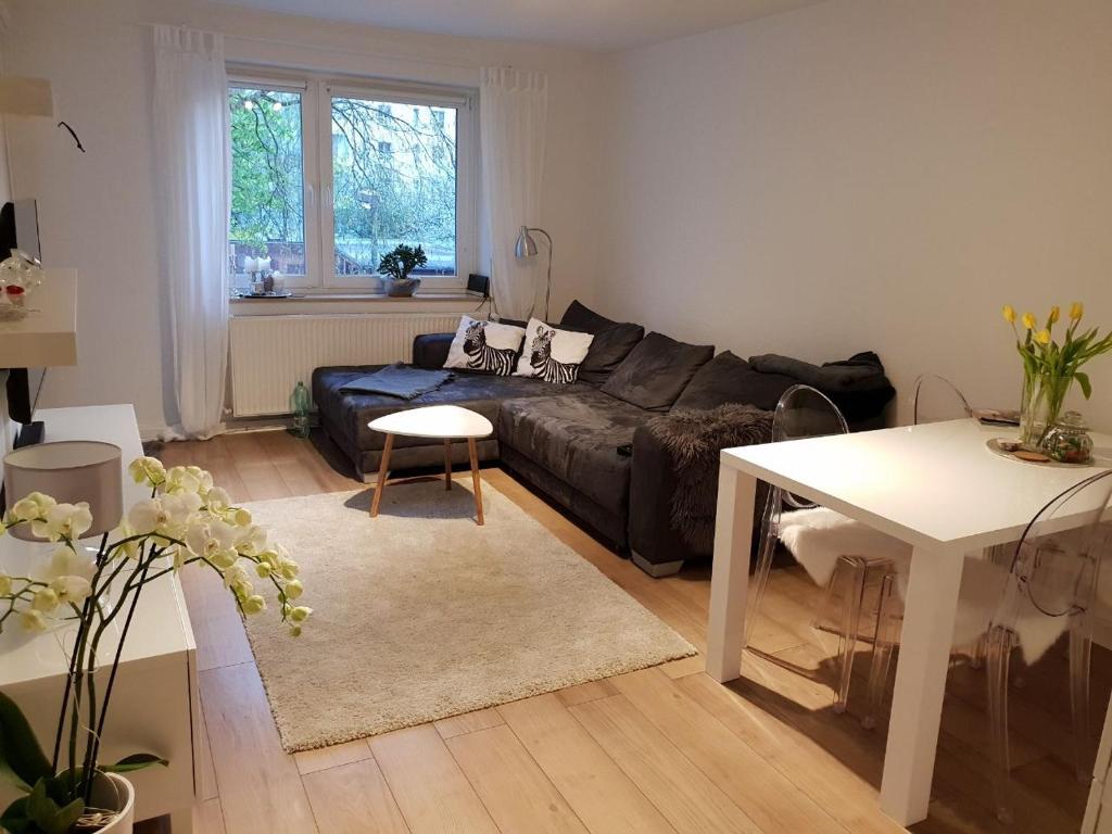 a living room with a couch and a table at BS Business Travelling Hannover Messe in Hannover