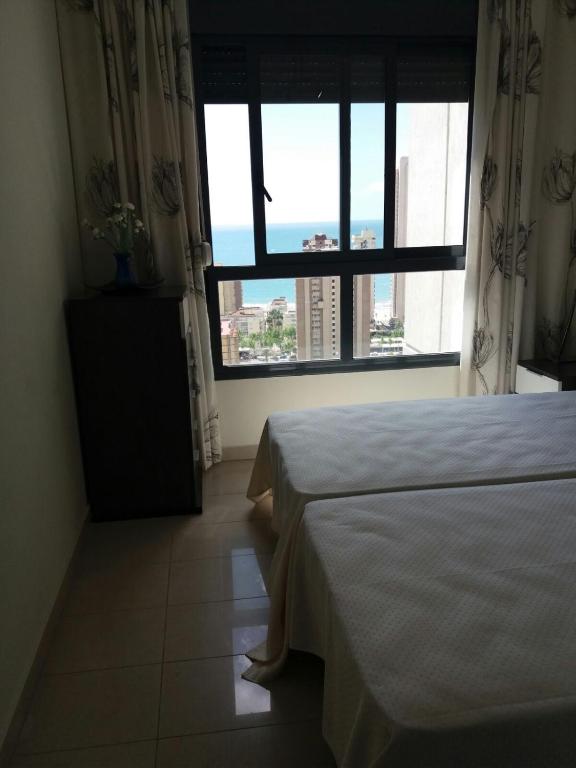 Postel nebo postele na pokoji v ubytování Apartment Carmentxu Gemelos 26