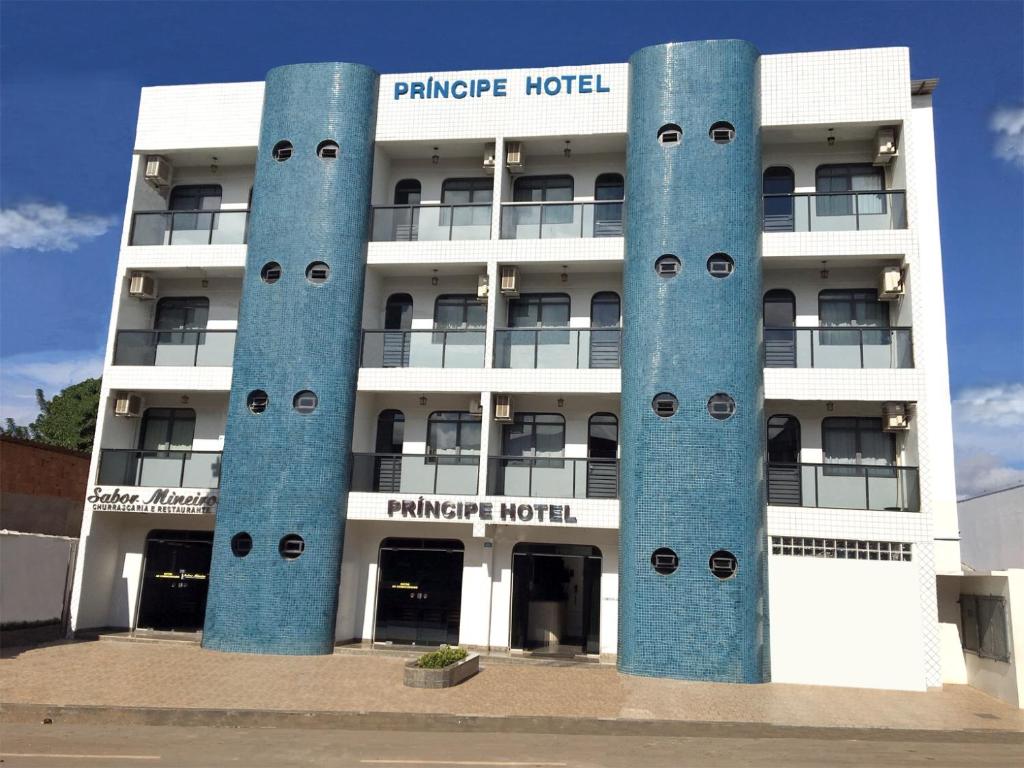 a building with blue columns in front of it at Principe Hotel in Barreiras