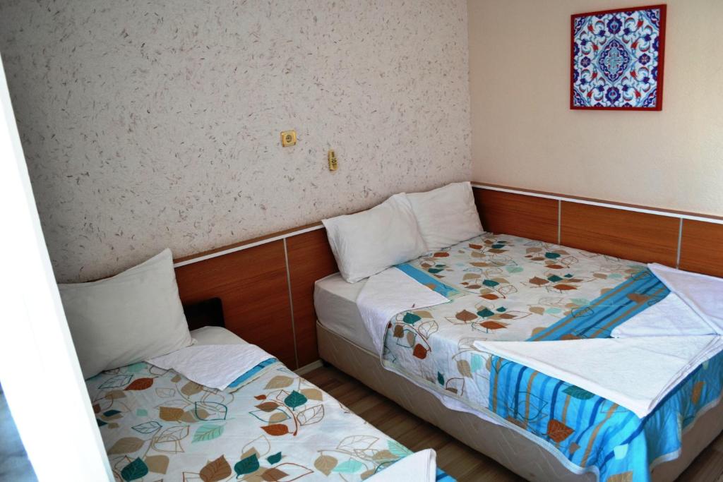 Giường trong phòng chung tại Aspawa Hotel