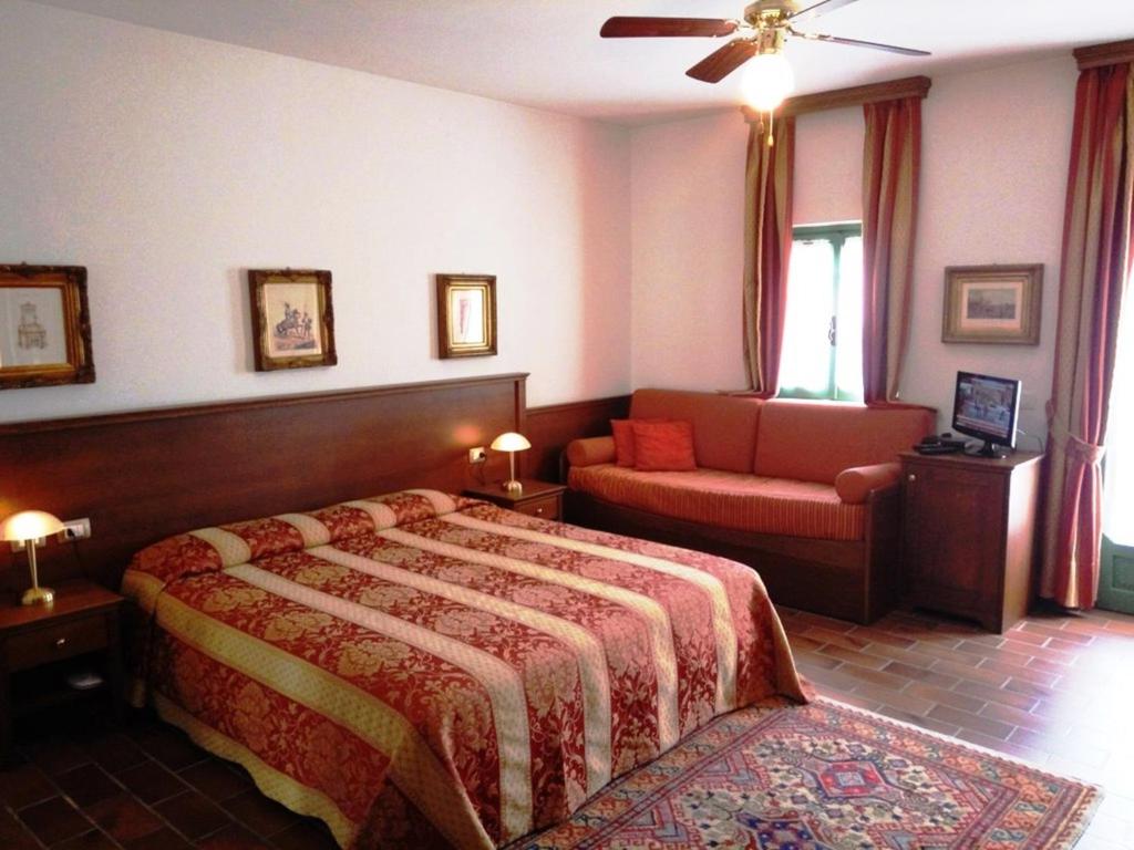 Łóżko lub łóżka w pokoju w obiekcie Casa Violetta B&B