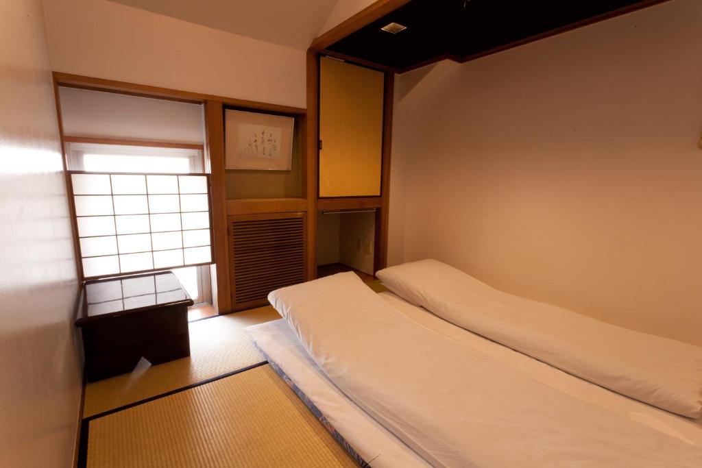 Letto o letti in una camera di Kimi Ryokan