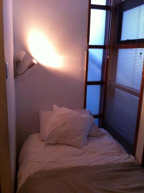 Postel nebo postele na pokoji v ubytování Hotel Latitud 33º Sur