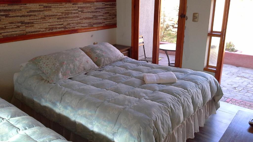 Postel nebo postele na pokoji v ubytování Hostal Puritama