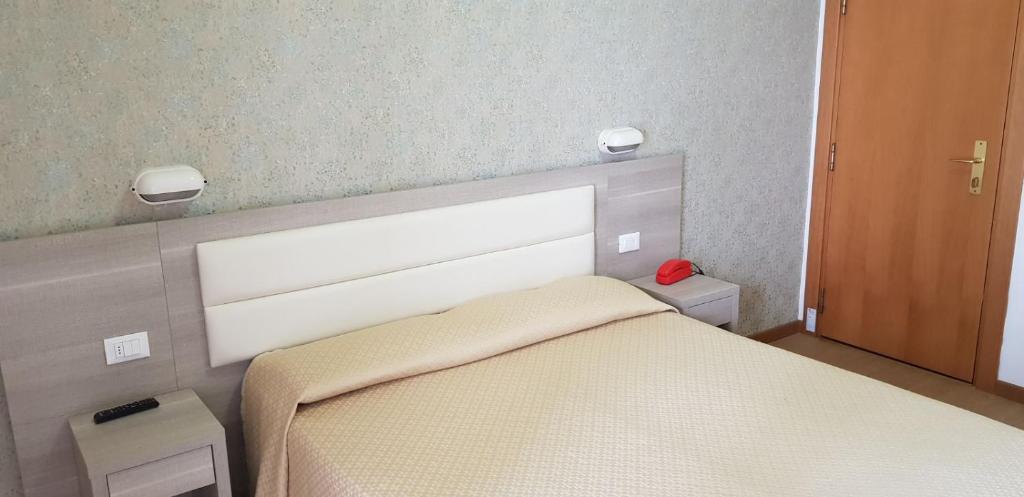 Postel nebo postele na pokoji v ubytování Hotel Basilea