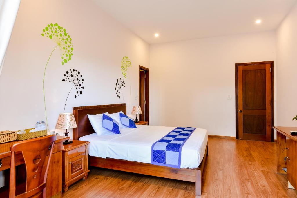 Postel nebo postele na pokoji v ubytování Tra Que Riverside Homestay