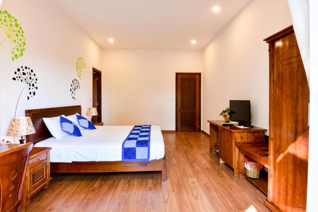 Postel nebo postele na pokoji v ubytování Tra Que Riverside Homestay