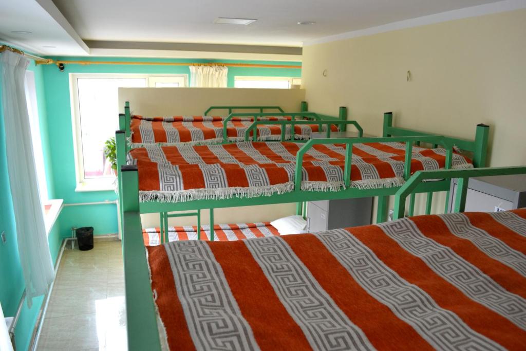 Danista Nomads Tour Hostel - Bed In Male Dormitory Room