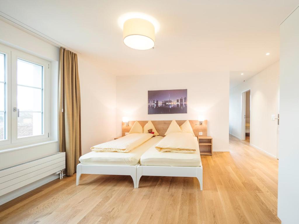 Postel nebo postele na pokoji v ubytování Aparthotel Bären