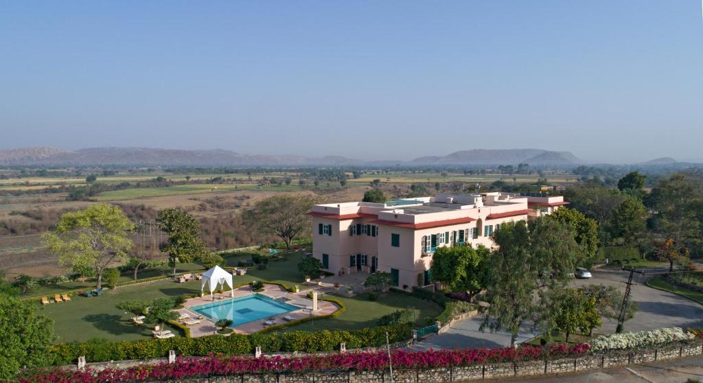 an aerial view of a house with a swimming pool at Ramgarh Lodge, Jaipur – IHCL SeleQtions in Jaipur