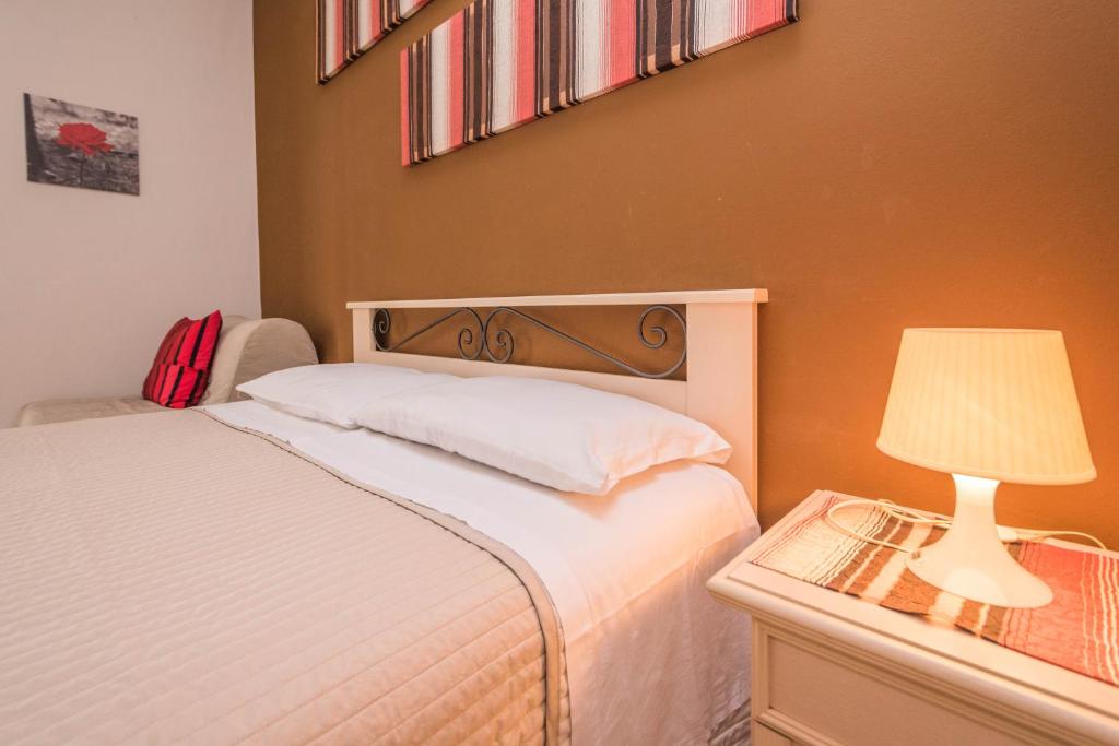 A bed or beds in a room at Il Muretto