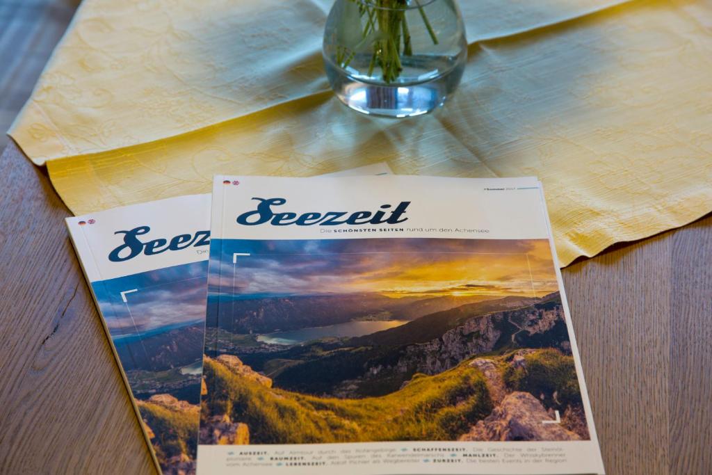 a book sitting on top of a table at Hotel Bergland in Pertisau