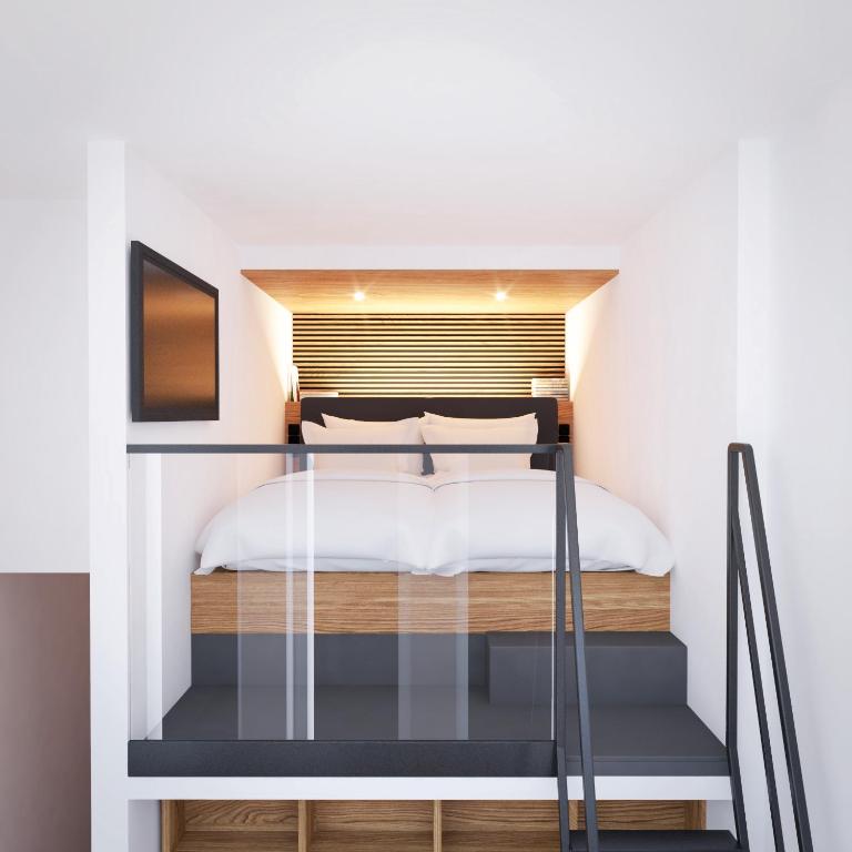 Postel nebo postele na pokoji v ubytování roomz Vienna Prater
