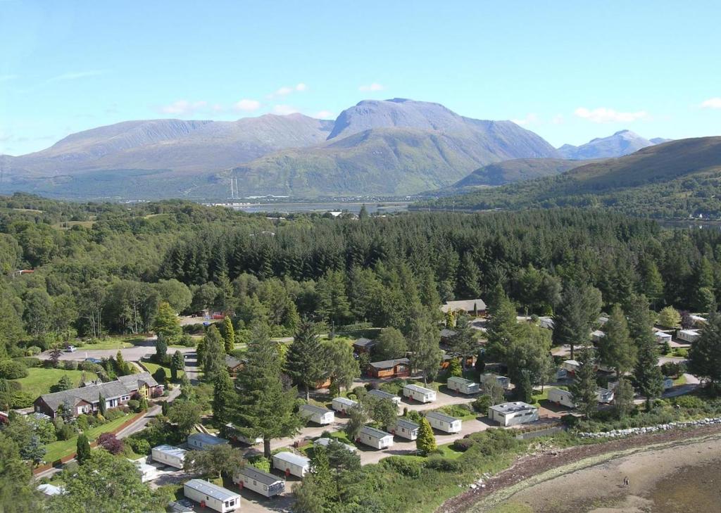 an aerial view of a village in the mountains at Linnhe Lochside Holidays in Corpach