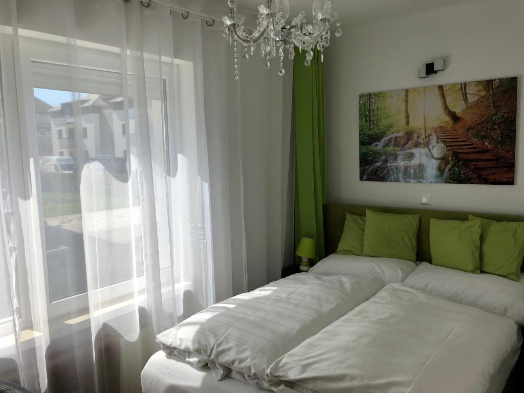 Postel nebo postele na pokoji v ubytování Enjoyit Rooms