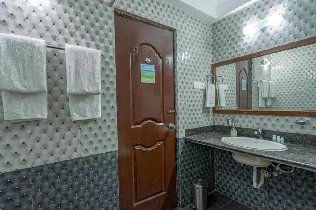 Koupelna v ubytování Rendezvous Beach Resort Panjim