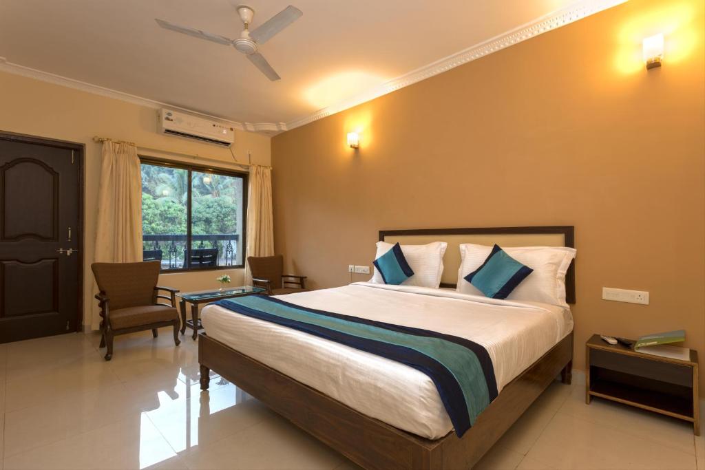 Postel nebo postele na pokoji v ubytování Rendezvous Beach Resort Panjim