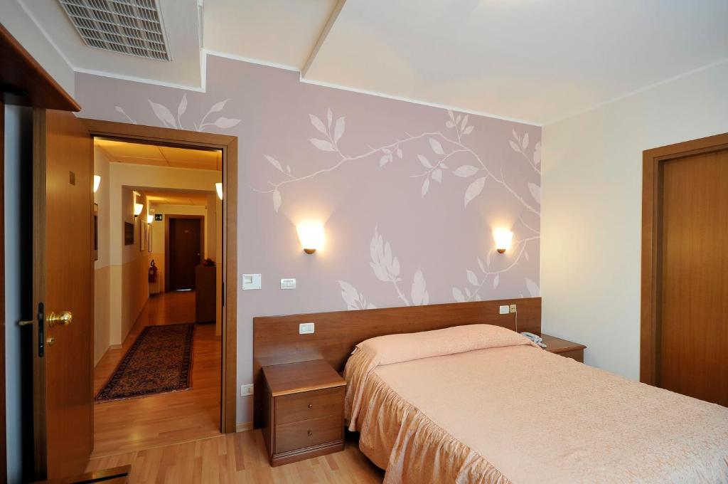 Postel nebo postele na pokoji v ubytování Ai Campi Di Marcello Hotel