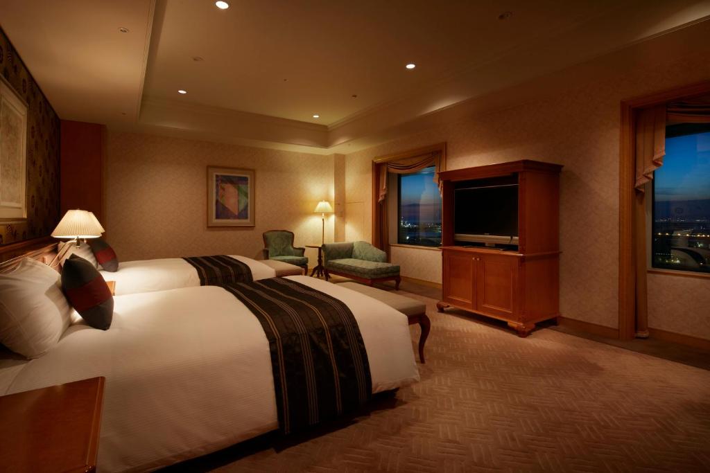 Postel nebo postele na pokoji v ubytování Hotel Agora Regency Osaka Sakai