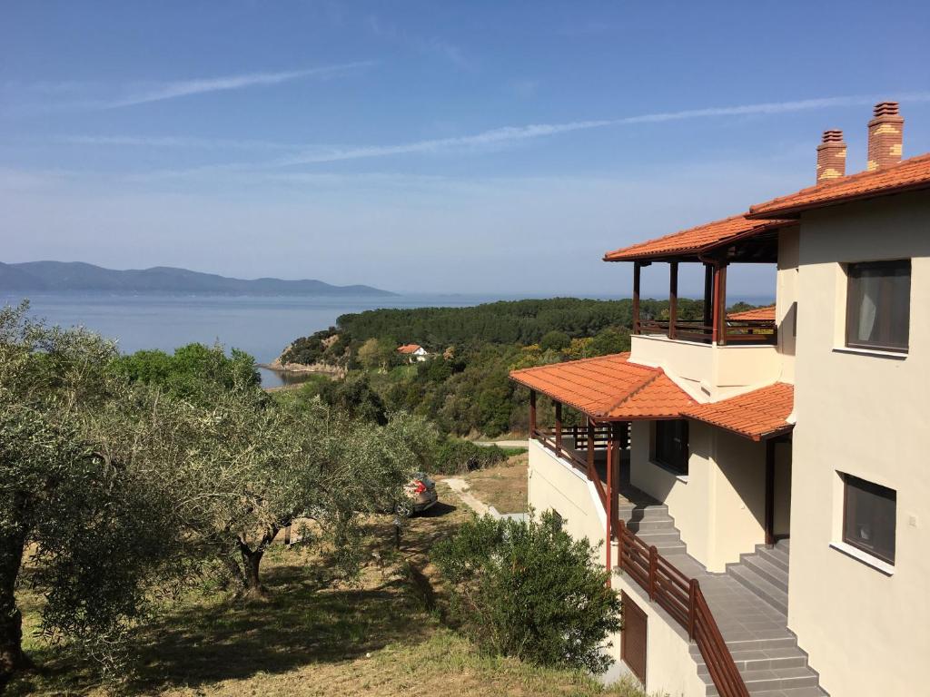 a house with a view of the water at Athinaios Porto Klisouri Villa in Ierissos