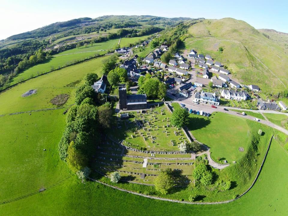 an aerial view of a village on a hill at Kilmartin Hotel in Kilmartin