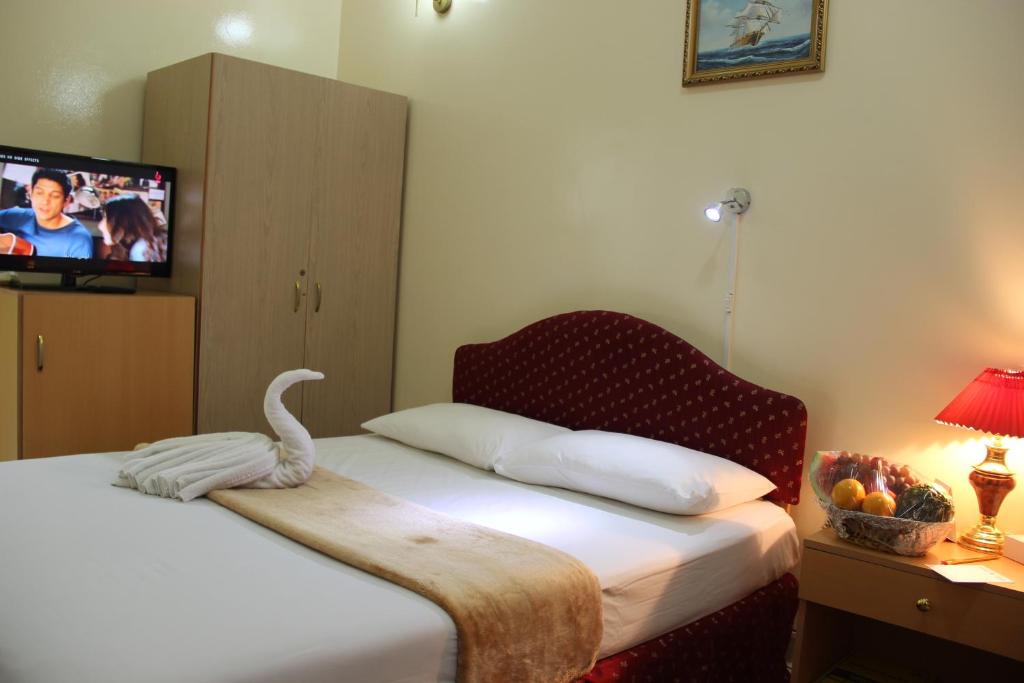 Postel nebo postele na pokoji v ubytování Royalton Hotel