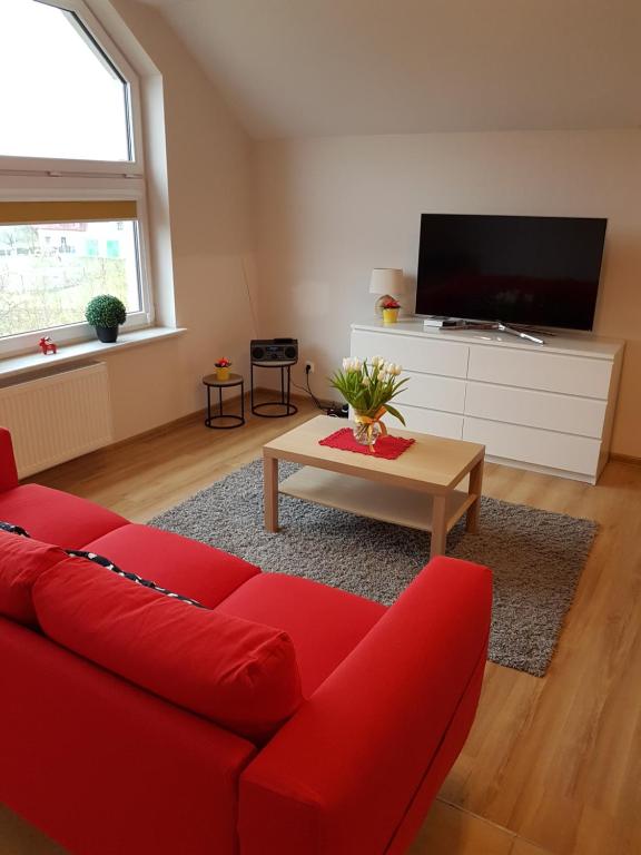 Televízia a/alebo spoločenská miestnosť v ubytovaní Apartment Karpacz