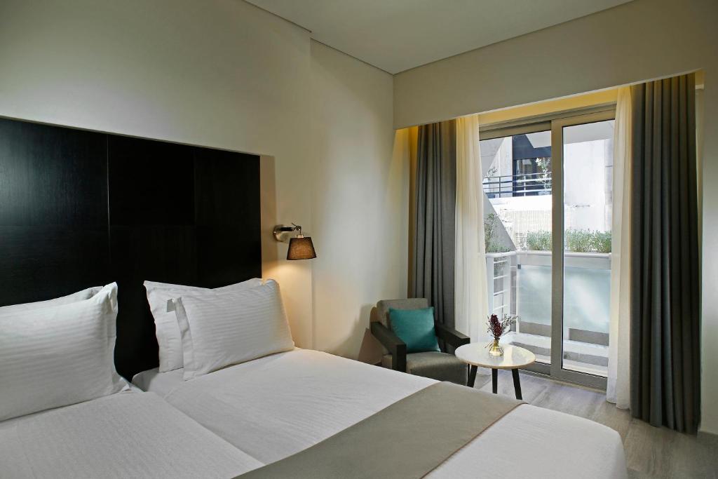 Postel nebo postele na pokoji v ubytování Hotel Lozenge