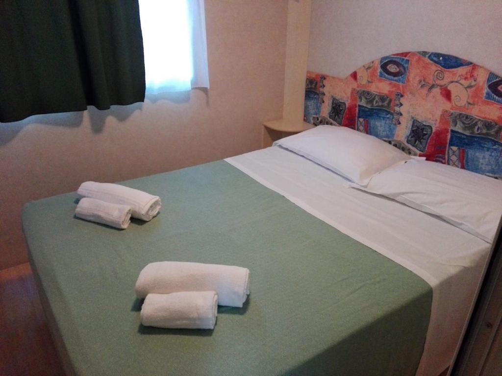 Posteľ alebo postele v izbe v ubytovaní Villaggio Mithos