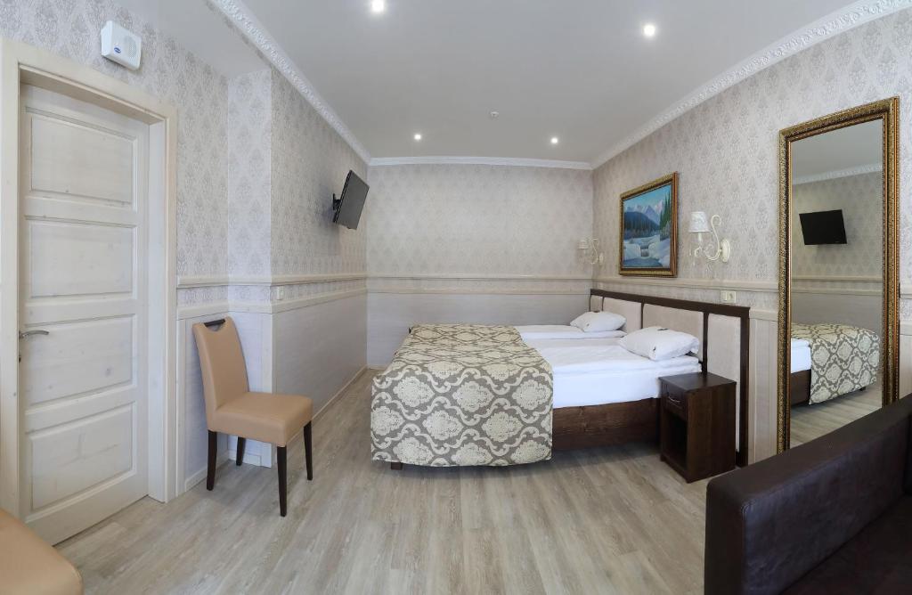 Postel nebo postele na pokoji v ubytování Home Hotel