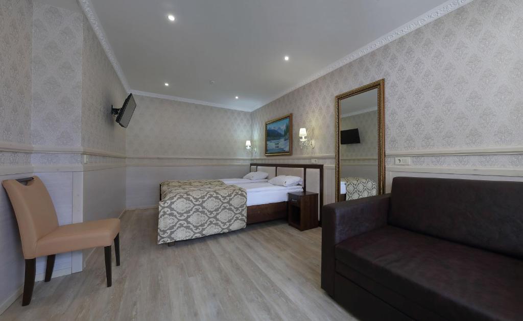 Postel nebo postele na pokoji v ubytování Home Hotel