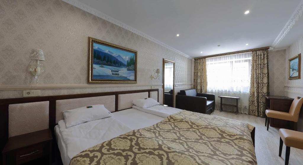 Postel nebo postele na pokoji v ubytování Home Hotel