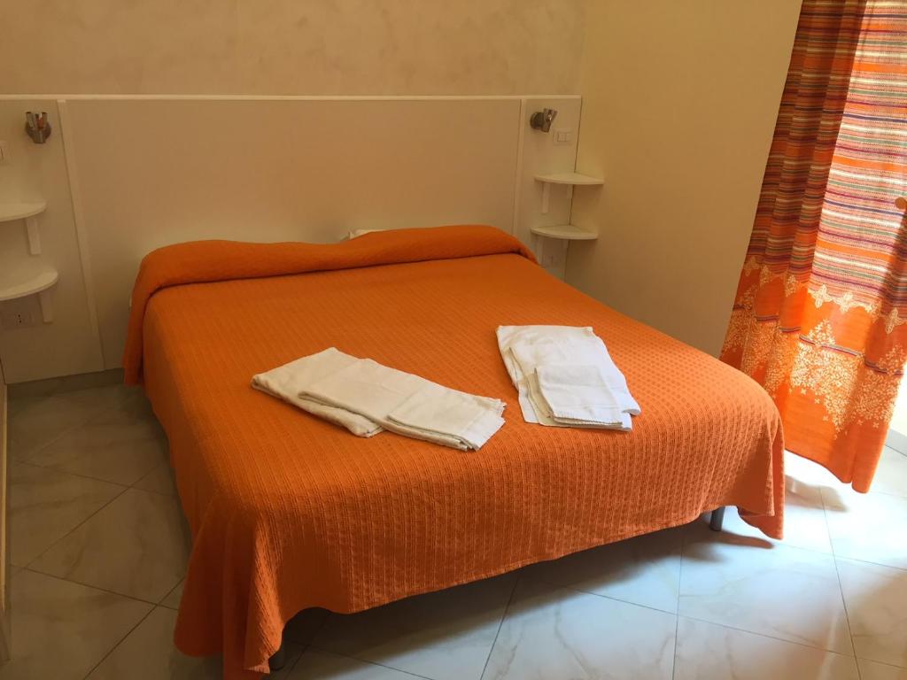 Postel nebo postele na pokoji v ubytování Albergo Oasi