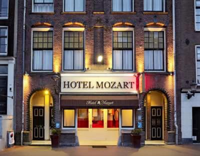 
a building with a sign on the front of it at Mozart Hotel in Amsterdam
