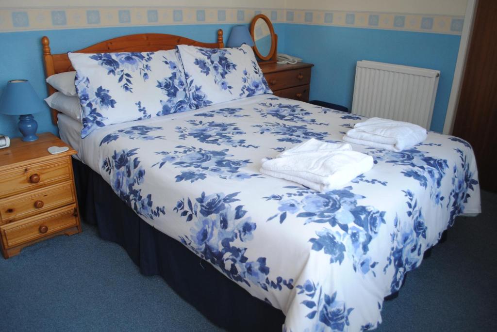 Postel nebo postele na pokoji v ubytování Craig-Ard Hotel
