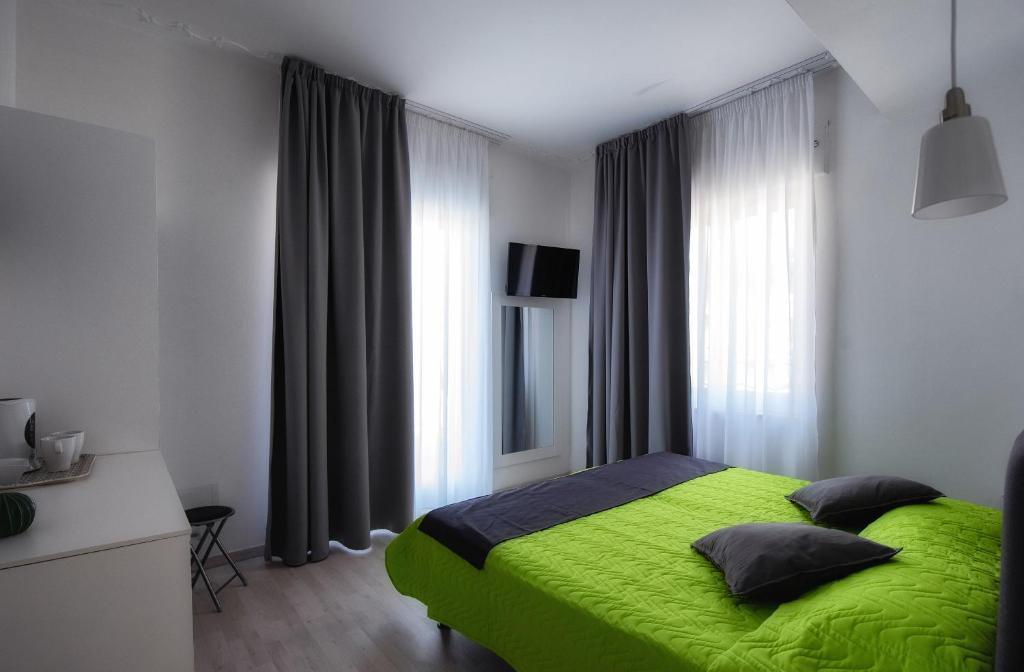 Postel nebo postele na pokoji v ubytování Sunset rooms