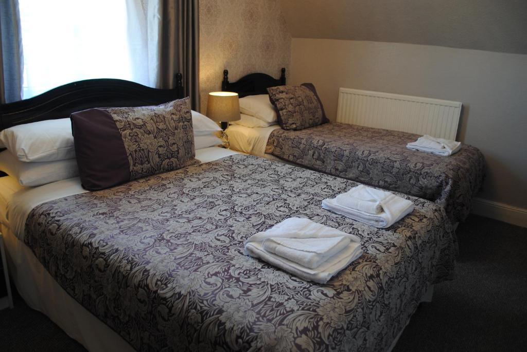 Postel nebo postele na pokoji v ubytování Craig-Ard Hotel