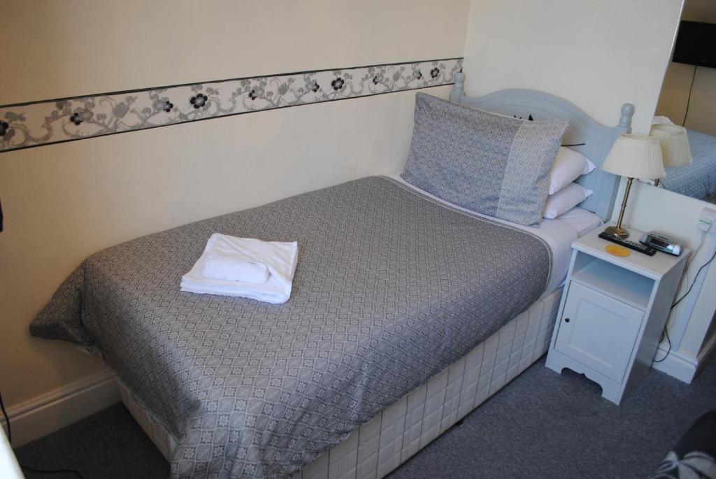 Postel nebo postele na pokoji v ubytování Craig-Ard Hotel