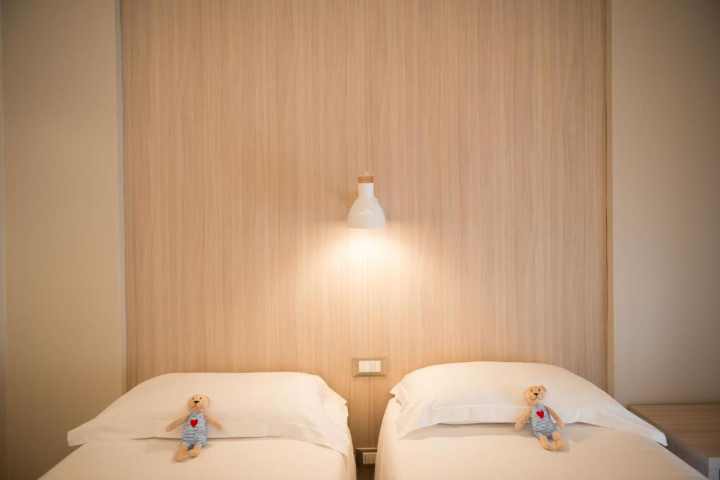 Postel nebo postele na pokoji v ubytování Hotel Delle Nazioni